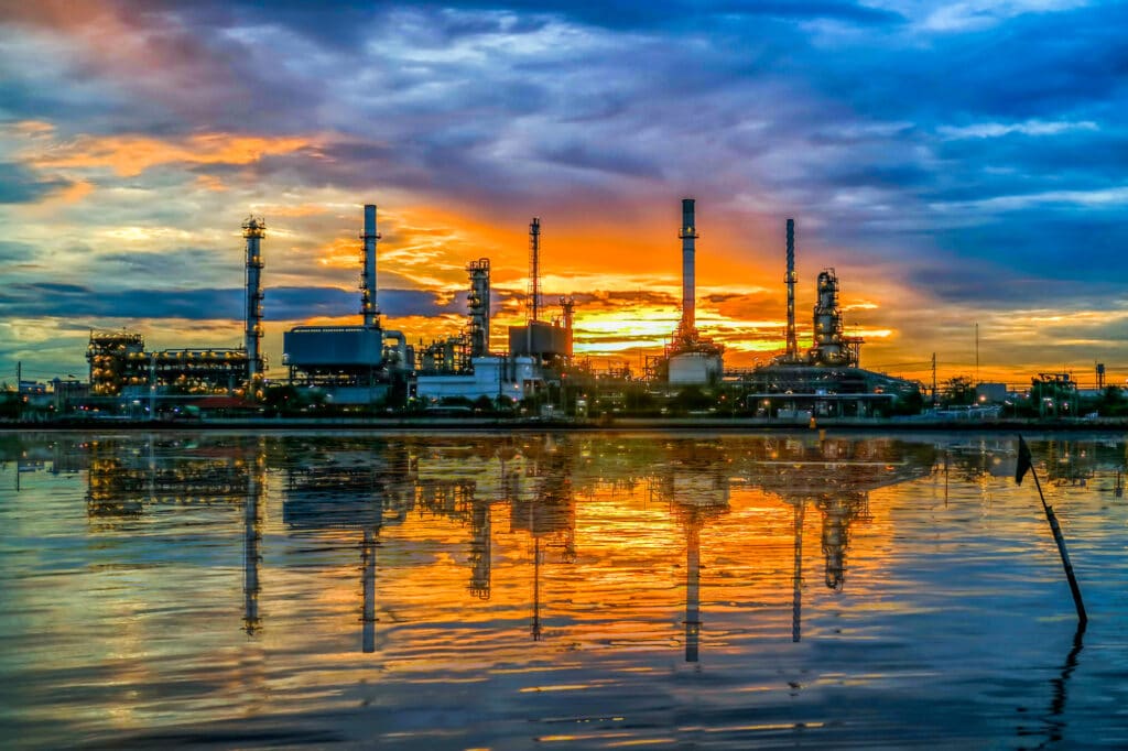 oil refinery at twilight and water reflection , Chao Phraya river, Thailand